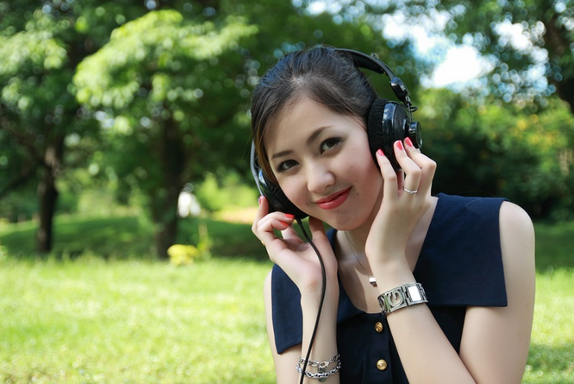 A beautiful smiling woman wearing headphone